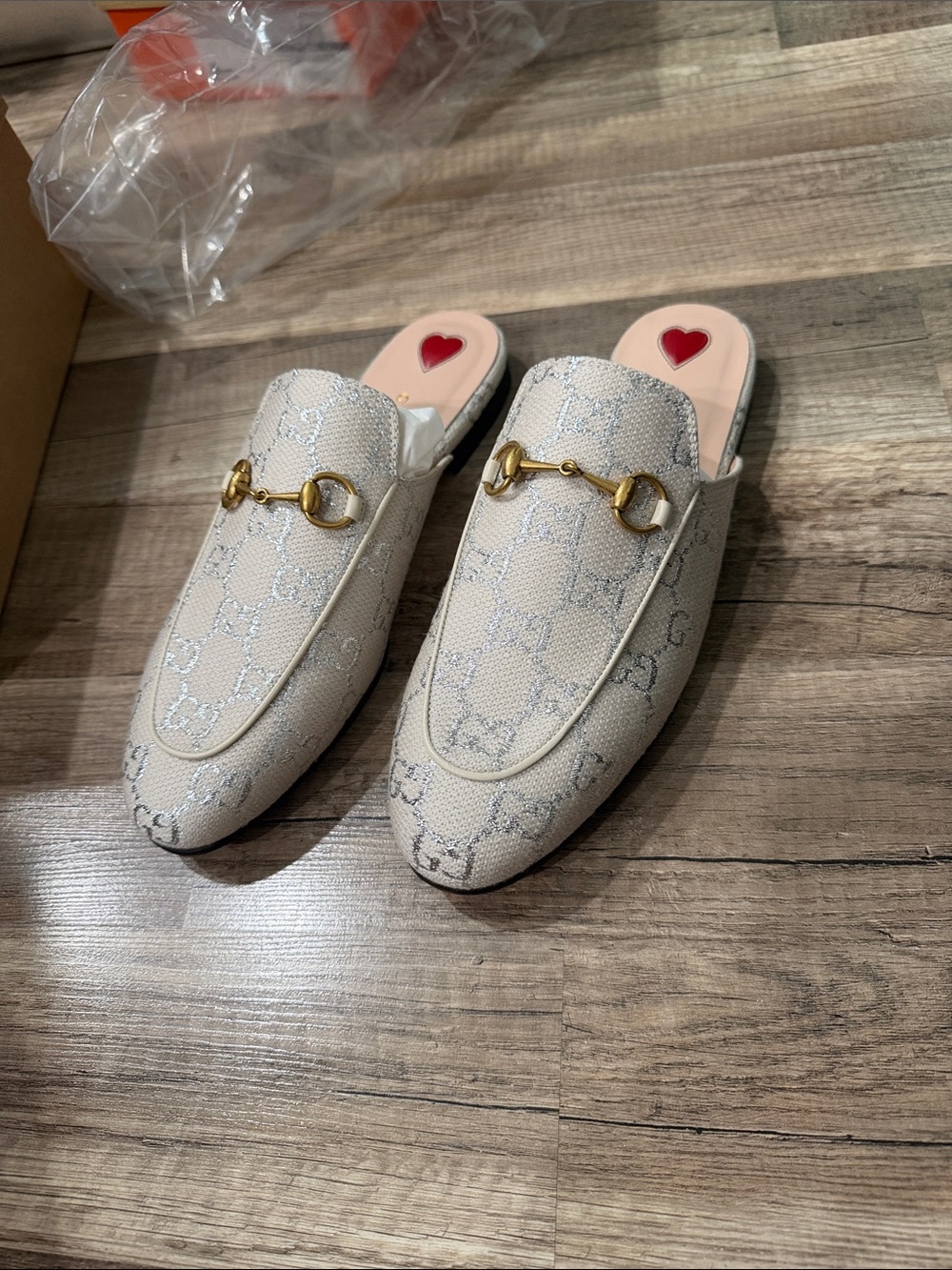 Gucci Women's Cream Embossed Slip-On Loafers with Gold Hardware